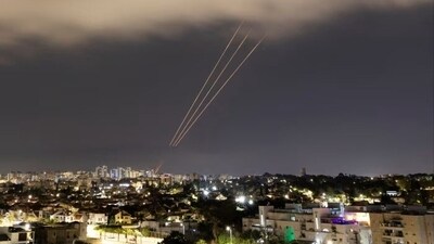 An anti-missile system operates after Iran launched drones and missiles towards Israel, as seen from Ashkelon, Israel. (Reuters)