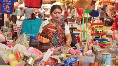 Mrs. Komal Bongode, a hawker who sells plastic items, also her son sits with her near her stall and studies at Mathuradas road, Kandivali West, Mumbai, India on Thursday, January 24, 2013. Photo by - Vidya Subramanian /Hindustan Times. (Hindustan Times) Mrs. Komal Bongode, a hawker who sells plastic items, also her son sits with her near her stall and studies at Mathuradas road, Kandivali West, Mumbai, India on Thursday, January 24, 2013. Photo by - Vidya Subramanian /Hindustan Times. (Hindustan Times)
