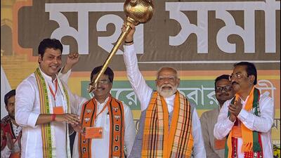 Prime Minister Narendra Modi with Tripura chief minister Manik Saha and BJP candidate Biplab Kumar Deb during a public meeting ahead of the Lok Sabha elections in Agartala on Wednesday. (PTI)