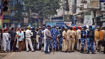Security personnel cordoned off an area after clashes broke out between two groups during a Ram Navami procession in Howrah district last year. (PTI) (File) Security personnel cordoned off an area after clashes broke out between two groups during a Ram Navami procession in Howrah district last year. (PTI) (File)