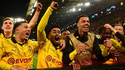 Dortmund's players celebrate scoring their forth goal 4:2 during the UEFA Champions League quarter-final second leg football match between vs Atletico Madrid (AFP) Dortmund's players celebrate scoring their forth goal 4:2 during the UEFA Champions League quarter-final second leg football match between vs Atletico Madrid (AFP)