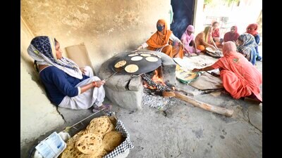 Workers preparing mid-day meal for students in Ludhiana. (HT Photo) Workers preparing mid-day meal for students in Ludhiana. (HT Photo)