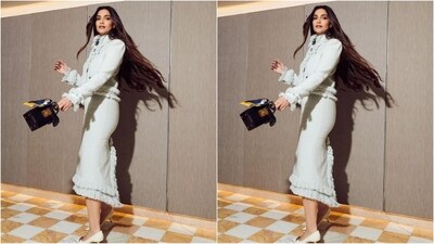 Assisted by her talented fashion stylist sister Rhea Kapoor, Sonam accessorised her look with diamond stud earrings, a mini black handbag and a pair of white pumps that complemented her look perfectly. (Instagram/@sonamkapoor) Assisted by her talented fashion stylist sister Rhea Kapoor, Sonam accessorised her look with diamond stud earrings, a mini black handbag and a pair of white pumps that complemented her look perfectly. (Instagram/@sonamkapoor)