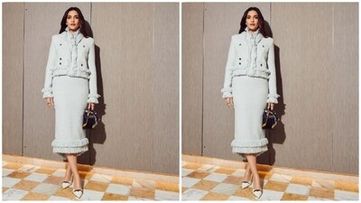 Her chic outfit is from the shelves of fashion brand Huishan Zhang and features a captivating white shade, a full-sleeved jacket with ruffled detailing and notched lapels. She paired it with a matching pencil skirt to add a touch of oomph. (Instagram/@sonamkapoor) Her chic outfit is from the shelves of fashion brand Huishan Zhang and features a captivating white shade, a full-sleeved jacket with ruffled detailing and notched lapels. She paired it with a matching pencil skirt to add a touch of oomph. (Instagram/@sonamkapoor)