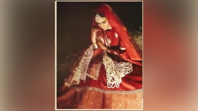 Kriti completed the ensemble by layering two dupattas - she wore a gold tissue silk dupatta with red borders as a veil on her head and pleated another heavily embroidered red dupatta on her shoulders. The ensemble is a great sartorial pick for any bride-to-be looking for a traditional, elegant and minimal look for their wedding.&nbsp; (Instagram)
