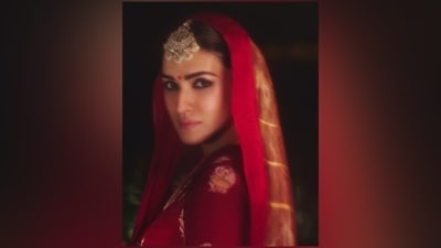 Lastly, Kriti styled the ensemble with white gajra Kaleeras, gold stacked metal bangles, gold ornate jhumkis, a statement mang tika, alta on the hands, kohl-lined eyes, smudged winged eyeliner, smoky eye shadow, darkened brows, red bindi, nude pink lip shade, rouge on the cheekbones, beaming highlighter, mascara-adorned lashes, and centre-parted gajra-adorned bun.&nbsp; (Instagram)