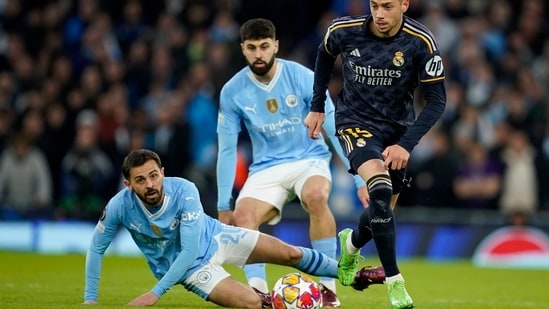 Manchester City v Real Madrid Champions League: City's Bernardo Silva fights for the ball with Real Madrid's Federico Valverde. (AP)