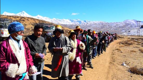 Voters standing in queue for their turn to cast their votes in the Himachal Pradesh assembly elections at the country’s highest polling station of Tashigang in Lahaul and Spiti district on November 12, 2022. (HT file photo)