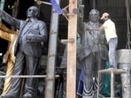 Workers clean the statue of Dr Babasaheb Ambedkar on the eve of Ambedkar Jayanti at a workshop in Jogeshwari, Mumbai. (Pratham Gokhale/HT photo)