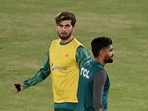 Pakistan's captain Babar Azam (R) and teammate Shaheen Shah Afridi (L) warm up during practice session. Pakistan's captain Babar Azam (R) and teammate Shaheen Shah Afridi (L) warm up during practice session.