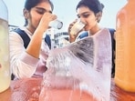 Girls cooling off with an iced drink near Masunda Lake in Thane as mercury dipped by five degrees Celsius after two days of scorching heat in Mumbai (Praful Gangurda/HT Photo)