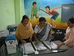 Officials work on Electronic Voting Machine (EVM) on the eve of the first phase of voting for the country's general election, at a polling station in Chennai on April 18, 2024. Nearly a billion Indians will vote to elect a new government in six-week-long parliamentary polls starting on April 19, the largest democratic exercise in the world. (Photo by R.Satish BABU / AFP)