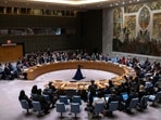 Representatives of member countries take votes during a Security Council meeting at United Nations headquarters. (AP)