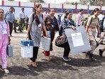 Polling officials leave for their respective polling stations after collecting EVMs and other election material ahead of the first phase of voting for Lok Sabha elections, in Tinsukia, Assam on Thursday.(ANI)