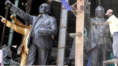 Workers clean the statue of Dr Babasaheb Ambedkar on the eve of Ambedkar Jayanti at a workshop in Jogeshwari, Mumbai. (Pratham Gokhale/HT photo) Workers clean the statue of Dr Babasaheb Ambedkar on the eve of Ambedkar Jayanti at a workshop in Jogeshwari, Mumbai. (Pratham Gokhale/HT photo)