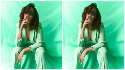 She accessorised her look with a pair of black rectangular sunglasses, diamond stud earrings, a gold heart-shaped pendant necklace, and a pair of stylish green heels to complement her stunning look. (Instagram/@egupta) She accessorised her look with a pair of black rectangular sunglasses, diamond stud earrings, a gold heart-shaped pendant necklace, and a pair of stylish green heels to complement her stunning look. (Instagram/@egupta)