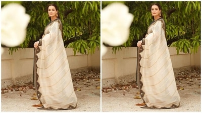 Her saree comes in a beige colour and features a rich silk organza fabric and adorned with intricate aari, applique, sequins and zari hand embroidery showcasing rich craftsmanship. She draped it elegantly around her with letting the pallu beautifully fall from the shoulders. (Instagram/@diamirzaofficial) Her saree comes in a beige colour and features a rich silk organza fabric and adorned with intricate aari, applique, sequins and zari hand embroidery showcasing rich craftsmanship. She draped it elegantly around her with letting the pallu beautifully fall from the shoulders. (Instagram/@diamirzaofficial)