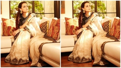 She paired her gorgeous saree with a black poly silk blouse with a round neckline, elbow-length sleeves and a mesmerising gold sequined embroidery on the neckline and borders. She wore a poly-satin petticoat for a finished and polished look. (Instagram/@diamirzaofficial) She paired her gorgeous saree with a black poly silk blouse with a round neckline, elbow-length sleeves and a mesmerising gold sequined embroidery on the neckline and borders. She wore a poly-satin petticoat for a finished and polished look. (Instagram/@diamirzaofficial)