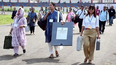 Polling officials leave for their respective polling stations after collecting EVMs and other election material, in Tinsukia, Assam. (ANI) Polling officials leave for their respective polling stations after collecting EVMs and other election material, in Tinsukia, Assam. (ANI)