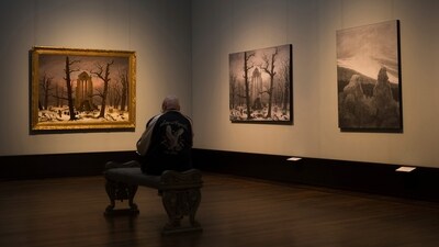 A man sits in front of a copy of Caspa David Friedrich's painting Monastery Cemetery In Snow' during a press preview of the exhibition 'Caspar David Friedrich. (AP Photo/Markus Schreiber) A man sits in front of a copy of Caspa David Friedrich's painting Monastery Cemetery In Snow' during a press preview of the exhibition 'Caspar David Friedrich. (AP Photo/Markus Schreiber)