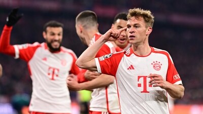 Bayern's Joshua Kimmich, right, celebrates with teammates after scoring his side's opening goal during the Champions League quarter final second leg (AP) Bayern's Joshua Kimmich, right, celebrates with teammates after scoring his side's opening goal during the Champions League quarter final second leg (AP)