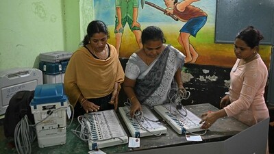 Officials work on Electronic Voting Machine (EVM) on the eve of the first phase of voting for the country's general election, at a polling station in Chennai on April 18, 2024. Nearly a billion Indians will vote to elect a new government in six-week-long parliamentary polls starting on April 19, the largest democratic exercise in the world. (Photo by R.Satish BABU / AFP) (AFP) Officials work on Electronic Voting Machine (EVM) on the eve of the first phase of voting for the country's general election, at a polling station in Chennai on April 18, 2024. Nearly a billion Indians will vote to elect a new government in six-week-long parliamentary polls starting on April 19, the largest democratic exercise in the world. (Photo by R.Satish BABU / AFP) (AFP)
