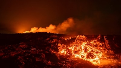 Officials worry that part of the volcano could collapse into the sea and cause a tsunami as in a 1871 eruption there. (AP) Officials worry that part of the volcano could collapse into the sea and cause a tsunami as in a 1871 eruption there. (AP)