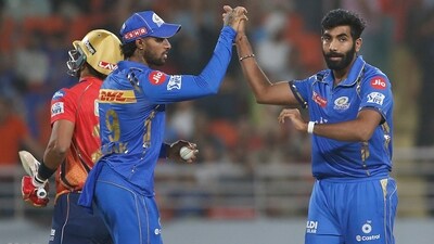 Mumbai Indians' Jasprit Bumrah , right, and Mumbai Indians' Tilak Varma celebrates the dismissal of Punjab Kings' Shashank Singh (AP) Mumbai Indians' Jasprit Bumrah , right, and Mumbai Indians' Tilak Varma celebrates the dismissal of Punjab Kings' Shashank Singh (AP)