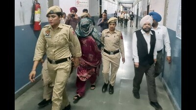 Police personnel producing Neelam in court in Ludhiana on Thursday. (Gurpreet Singh/HT)