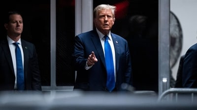 Former US President Donald Trump, center, returns from a break at Manhattan criminal court in New York, US. (Bloomberg) Former US President Donald Trump, center, returns from a break at Manhattan criminal court in New York, US. (Bloomberg)