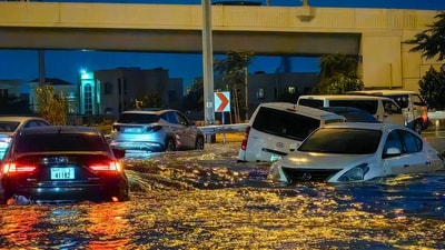 Cars drive in a flooded street following heavy rains in Dubai on April 17. (AFP) Cars drive in a flooded street following heavy rains in Dubai on April 17. (AFP)