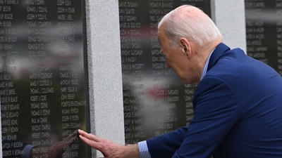 US President Joe Biden pays respects to his uncle World War II veteran Ambrose J, Finnegan, Jr. at the Veterans War Memorial in Scranton, Pennsylvania, before departing for Pittsburgh, on April 17, 2024. Biden is traveling to Pittsburgh, Pennsylvania, to meet with steelworkers. (Photo by ANDREW CABALLERO-REYNOLDS / AFP) (AFP)