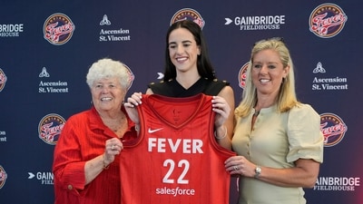 Indiana Fever's Caitlin Clark, middle, poses with general manager Lin Dunn, left, and head coach Christie Sides following a WNBA basketball news conference. (AP Photo/Darron Cummings) Indiana Fever's Caitlin Clark, middle, poses with general manager Lin Dunn, left, and head coach Christie Sides following a WNBA basketball news conference. (AP Photo/Darron Cummings)