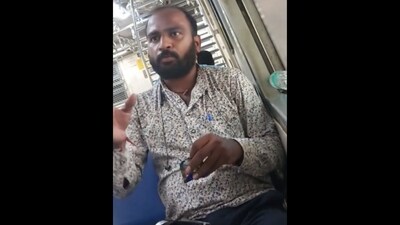 Man who threw gutka packet from the train window. (X/@dharmeshbarai) Man who threw gutka packet from the train window. (X/@dharmeshbarai)