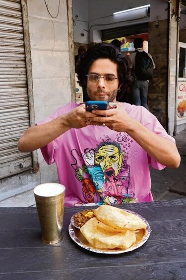 The actor gorges on a plate of chhole bhature and a tall glass of lassi and shares, "My first two days back in Delhi, I only ate chhole bhature!" (Photo: Dhruv Sethi/HT) The actor gorges on a plate of chhole bhature and a tall glass of lassi and shares, "My first two days back in Delhi, I only ate chhole bhature!" (Photo: Dhruv Sethi/HT)