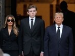 Former President Donald Trump, center right, stands with his wife Melania, second left, their son Barron, center left, as the coffin carrying the remains of Amalija Knavs, the former first lady's mother. (AP Photo/Rebecca Blackwell)