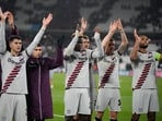Leverkusen players celebrate after the Europa League quarterfinal second leg soccer match against West Ham
