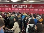 People queue at a flight connection desk after a rainstorm hit Dubai, causing delays at the Dubai International Airport, United Arab Emirates on April 17. 