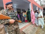 Security personnel stand guard as women arrive to cast their votes during Phase-I voting for the Lok Sabha elections 2024, in Kathua on Friday. (ANI Photo) Security personnel stand guard as women arrive to cast their votes during Phase-I voting for the Lok Sabha elections 2024, in Kathua on Friday. (ANI Photo)