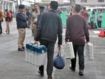 Polling officials after collecting EVMs and other election material on the eve of the first phase of Lok Sabha elections, in Sikkim on Thursday. (ANI)