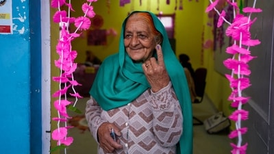 An elderly woman with the indelible ink mark on her finger after casting her vote at a women-only booth in Doda district, UT of Jammu and Kashmir. (Channi Anand / AP)