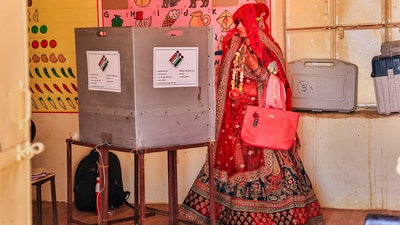A newly-wed woman casts her vote in Barwara, Jaipur, Rajasthan. (PTI)