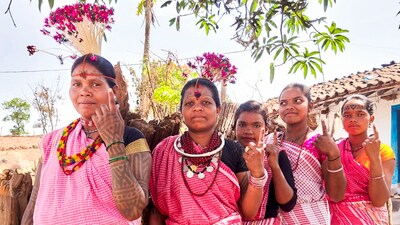 Women from the Baiga tribe show their fingers marked with ink after casting their votes in Dindori district, Madhya Pradesh.&nbsp; (PTI)