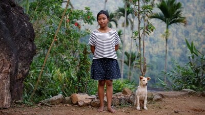 Lavinia Synrem, 22, a first-time voter, outside her house in Nongriat village, the location of a remote polling station, on Thursday, in Shillong, Meghalaya. (Adnan Abidi / Reuters)