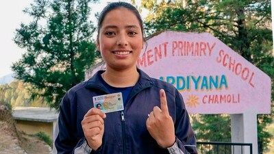 A first-time voter shows her finger marked with indelible ink after casting her vote in Chamoli, Uttarakhand. (PTI)