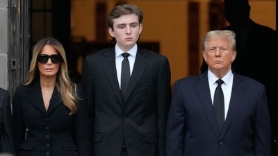 Former President Donald Trump, center right, stands with his wife Melania, second left, their son Barron, center left, as the coffin carrying the remains of Amalija Knavs, the former first lady's mother. (AP Photo/Rebecca Blackwell) (AP) Former President Donald Trump, center right, stands with his wife Melania, second left, their son Barron, center left, as the coffin carrying the remains of Amalija Knavs, the former first lady's mother. (AP Photo/Rebecca Blackwell) (AP)