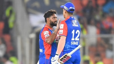 Delhi Capitals' captain Rishabh Pant (L) celebrates with teammate after their win at the end of Indian Premier League (IPL) Twenty20 cricket match between Delhi Capitals and Gujarat Titans (AFP)
