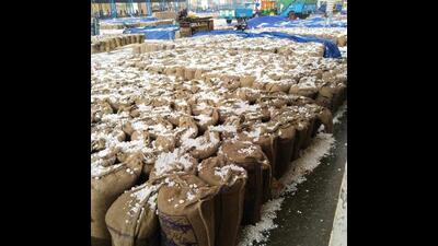 Hail-covered sacks of grains at the mandi in Indri in Karnal on Friday. (HT Photo)