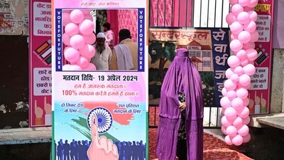 A burqa-clad woman waits to enter a polling station to cast her vote in the first phase of India's general election in Kairana, Shamli district, in Uttar Pradesh. (AFP)