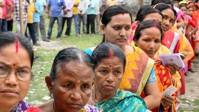 Voters queue up to cast their ballots as the first phase of India's general election begins at a polling station in Kalamati village, Dinhata district of Cooch Behar in West Bengal. (AFP)